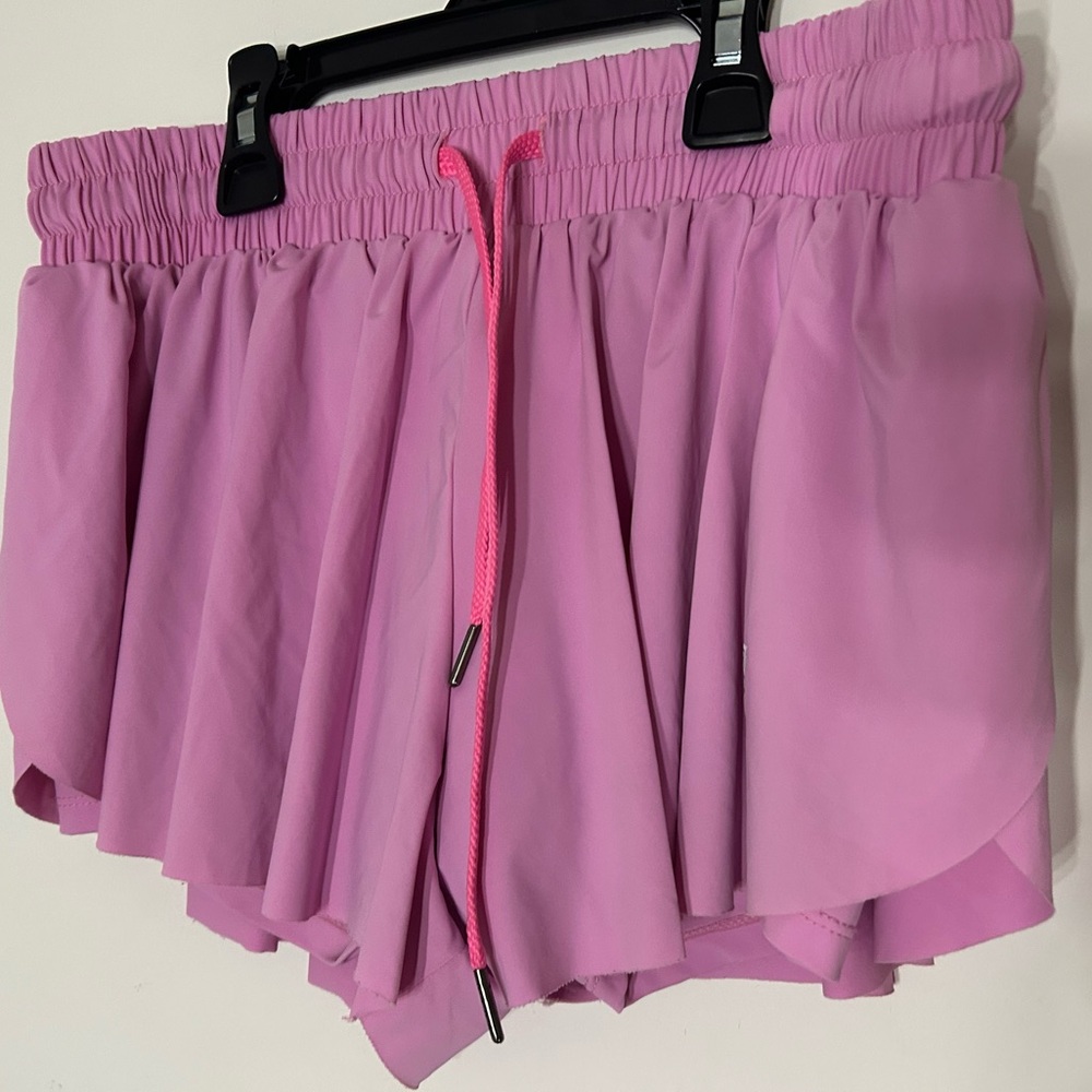 Pink flowy athletic shorts